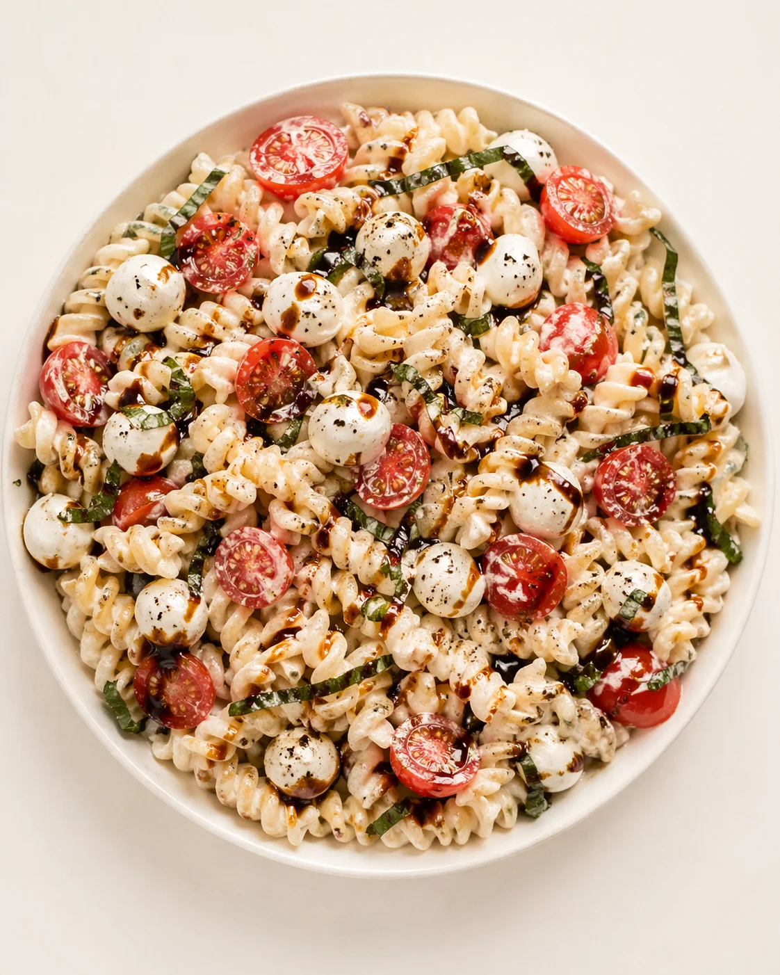 Straight-down overhead view of Creamy Caprese Pasta Salad