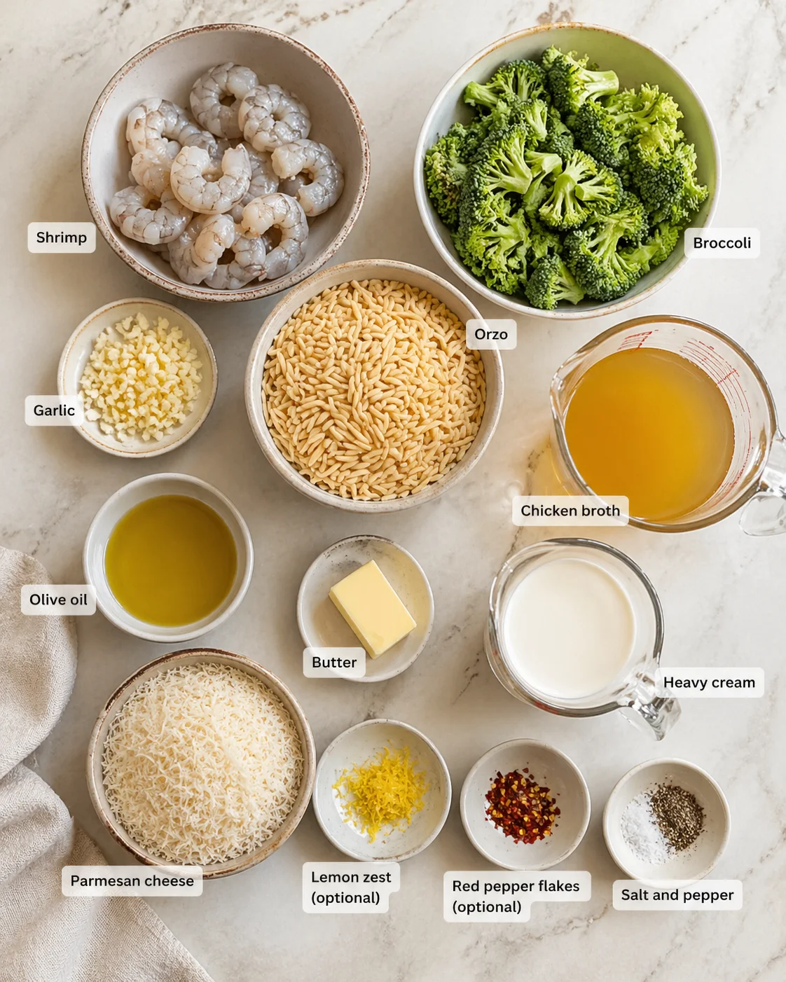 Measured ingredients arranged for Creamy Orzo Shrimp Broccoli A Delightful Dinner Recipe! - Dishes Tasty | Easy & Delicious Recipes: Large shrimp, peeled and deveined, Chopped broccoli florets, Minced garlic, Orzo pasta,