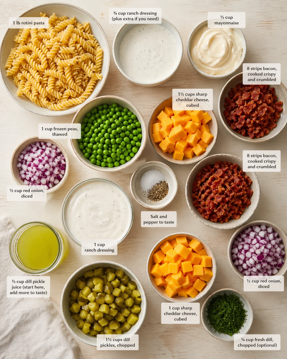 Measured ingredients arranged for 15 Easy Pasta Salad Recipes You Can Make in 30 Minutes: 1 lb rotini pasta, ¾ cup ranch dressing (plus extra if you need), ½ cup mayonnaise, 8 strips of bacon, cooked crispy and crumbled,