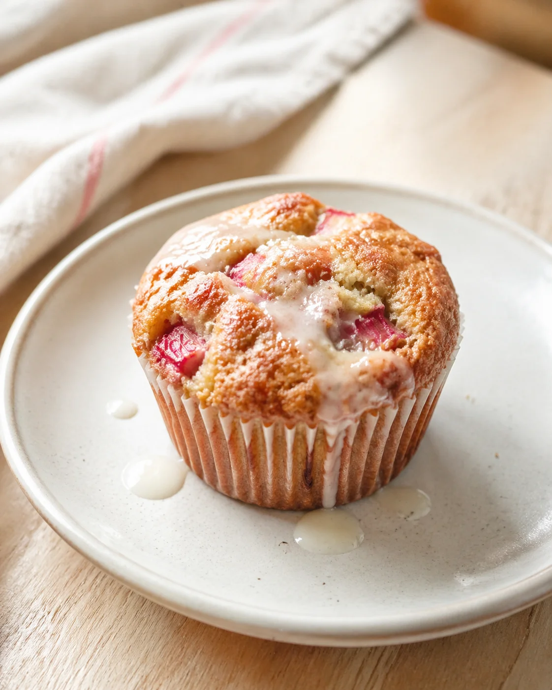 Single plated variation of Rhubarb Greek Yogurt Muffins: Bake Perfectly Soft Treats! shown in a natural kitchen scene