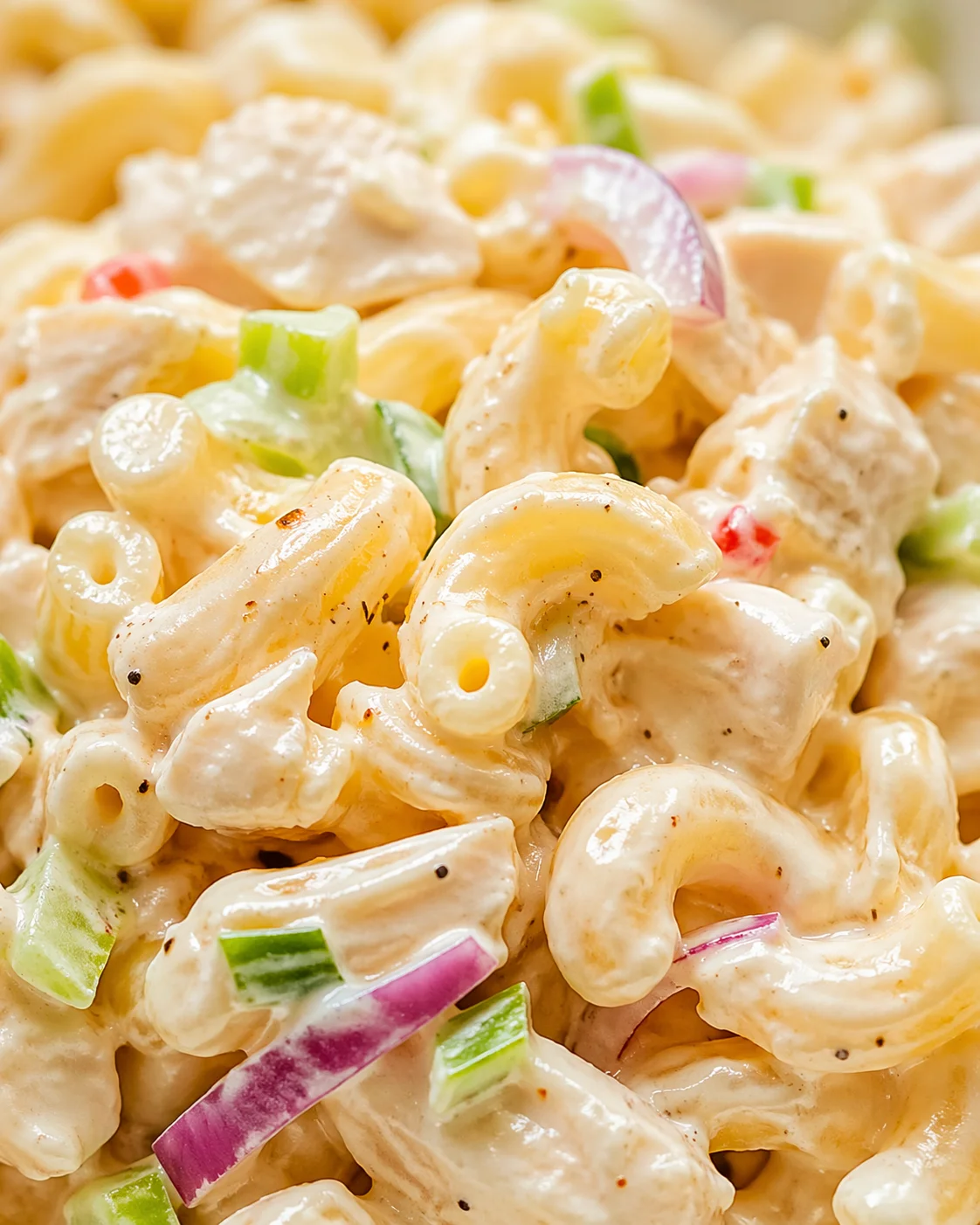 Tight detail shot of Ultimate Cold Chicken Macaroni Salad: A Delicious Summer Treat highlighting texture