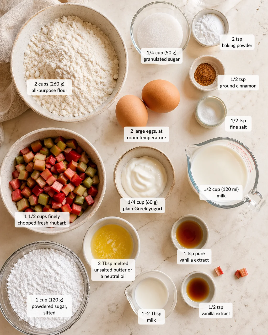 Measured ingredients arranged for Baked Rhubarb Fritters: 2 cups (260 g) all-purpose flour, 1/4 cup (50 g) granulated sugar, 2 tsp baking powder, 1/2 tsp ground cinnamon, 1/2 tsp fine salt, 2 large eggs, at room temperat