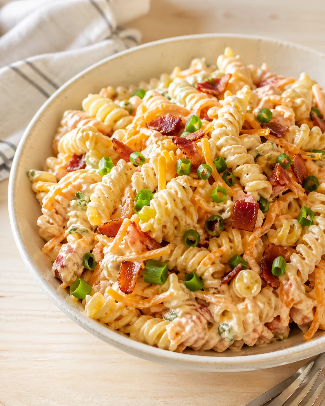 Single plated variation of Bacon Cheddar Ranch Pasta Salad: Your New BBQ Essential! shown in a natural kitchen scene