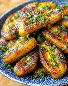 golden-brown roasted potato wedges with parsley in a blue speckled bowl