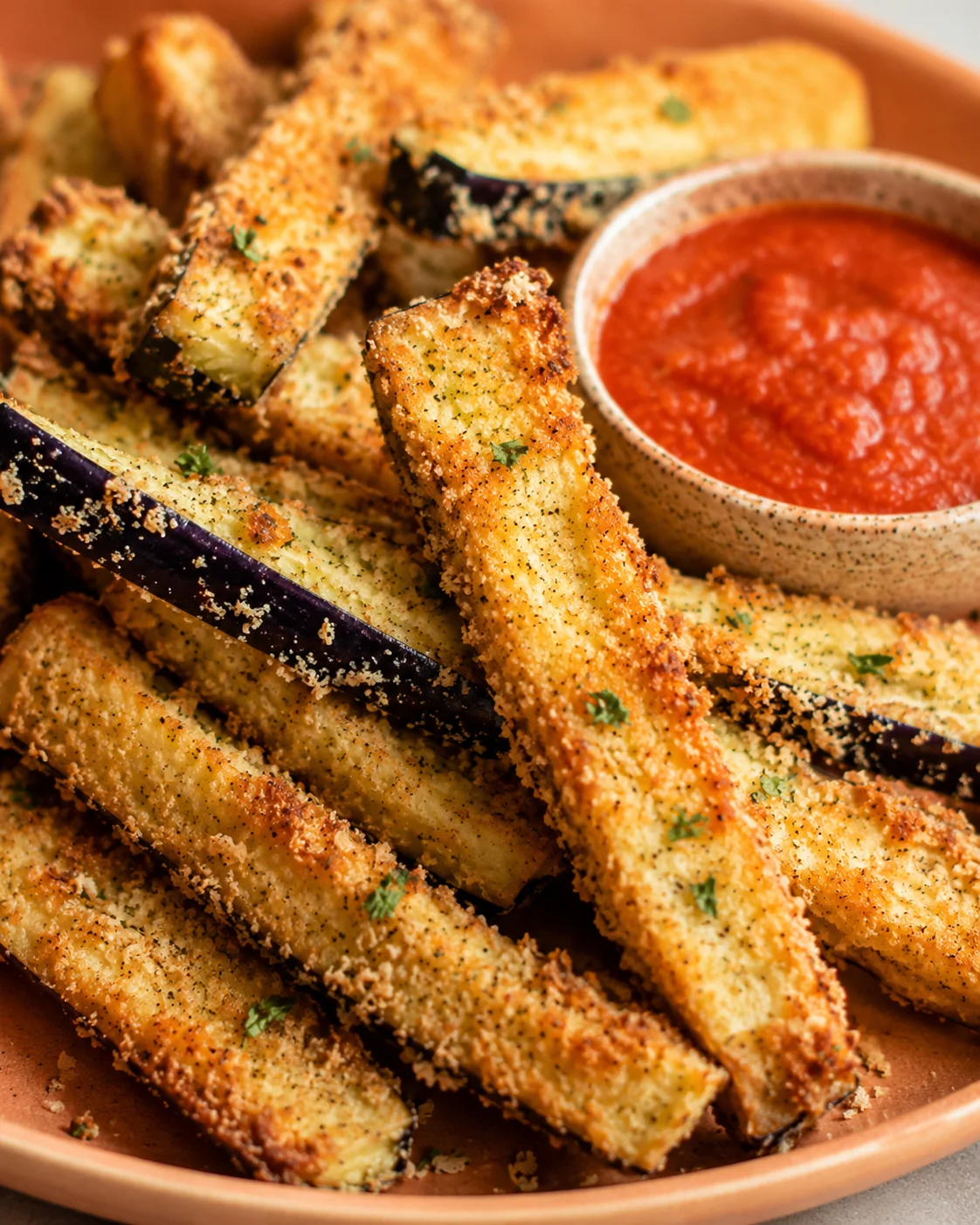 Golden, crispy air fryer eggplant fries served with marinara sauce