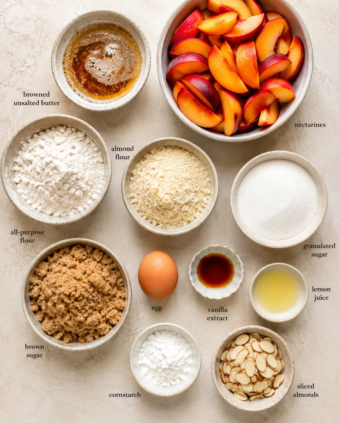 Brown Butter Nectarine Crumble Bars Close-up of ingredients for making nectarine crumble bars, including butter, nectarines, and flour.