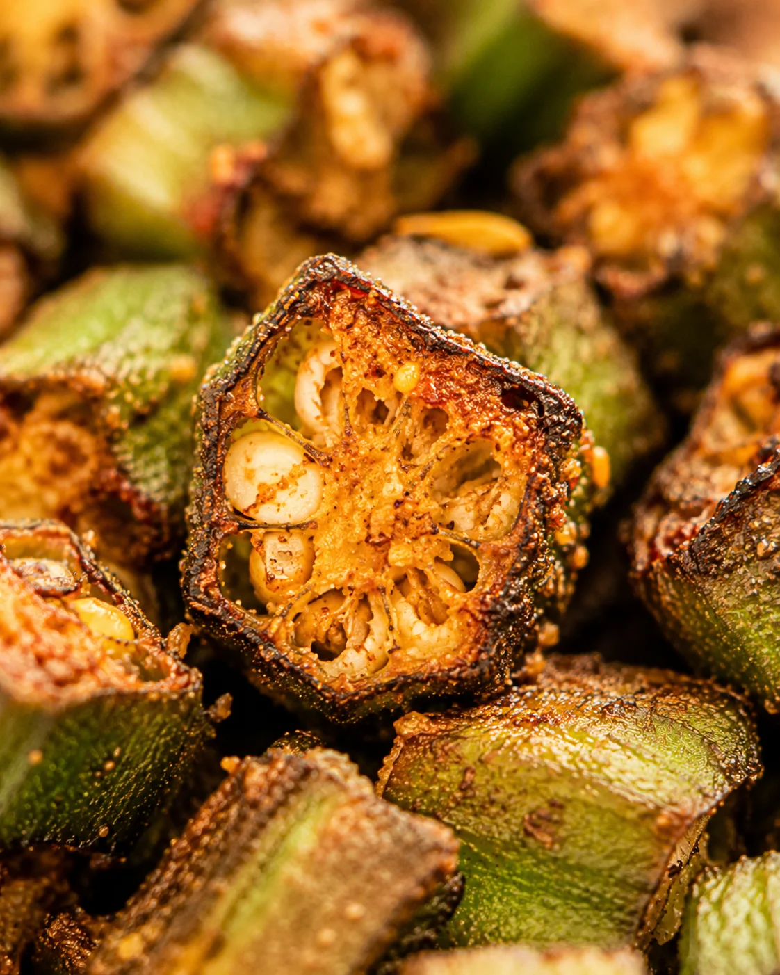 Close-up of golden, crispy roasted okra with smoky seasoning, perfect for a side dish.