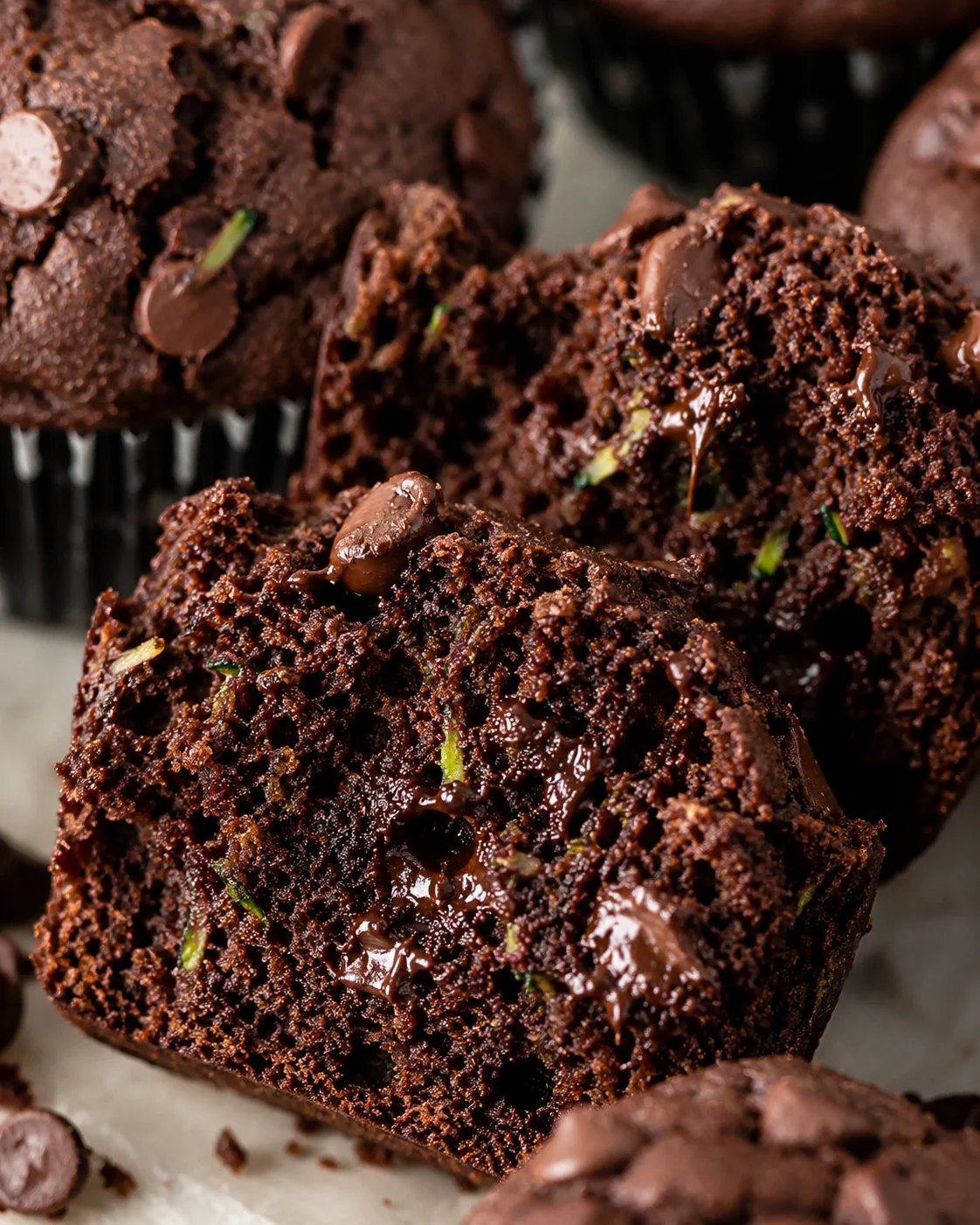 Chocolate Zucchini Muffins Close-up of moist, chocolate zucchini muffins with chocolate chips, freshly baked.