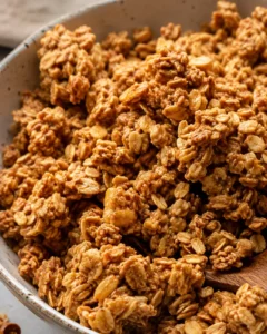 Crunchy homemade peanut butter granola in a bowl, ready to enjoy.