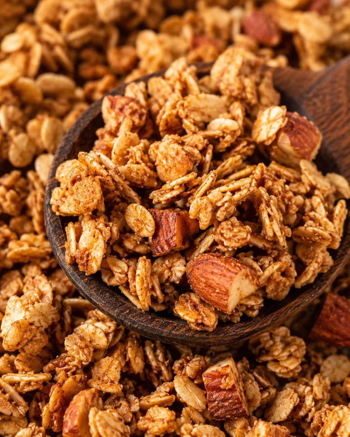 Homemade Maple Nut Granola Close-up of crunchy maple nut granola with almonds and cinnamon