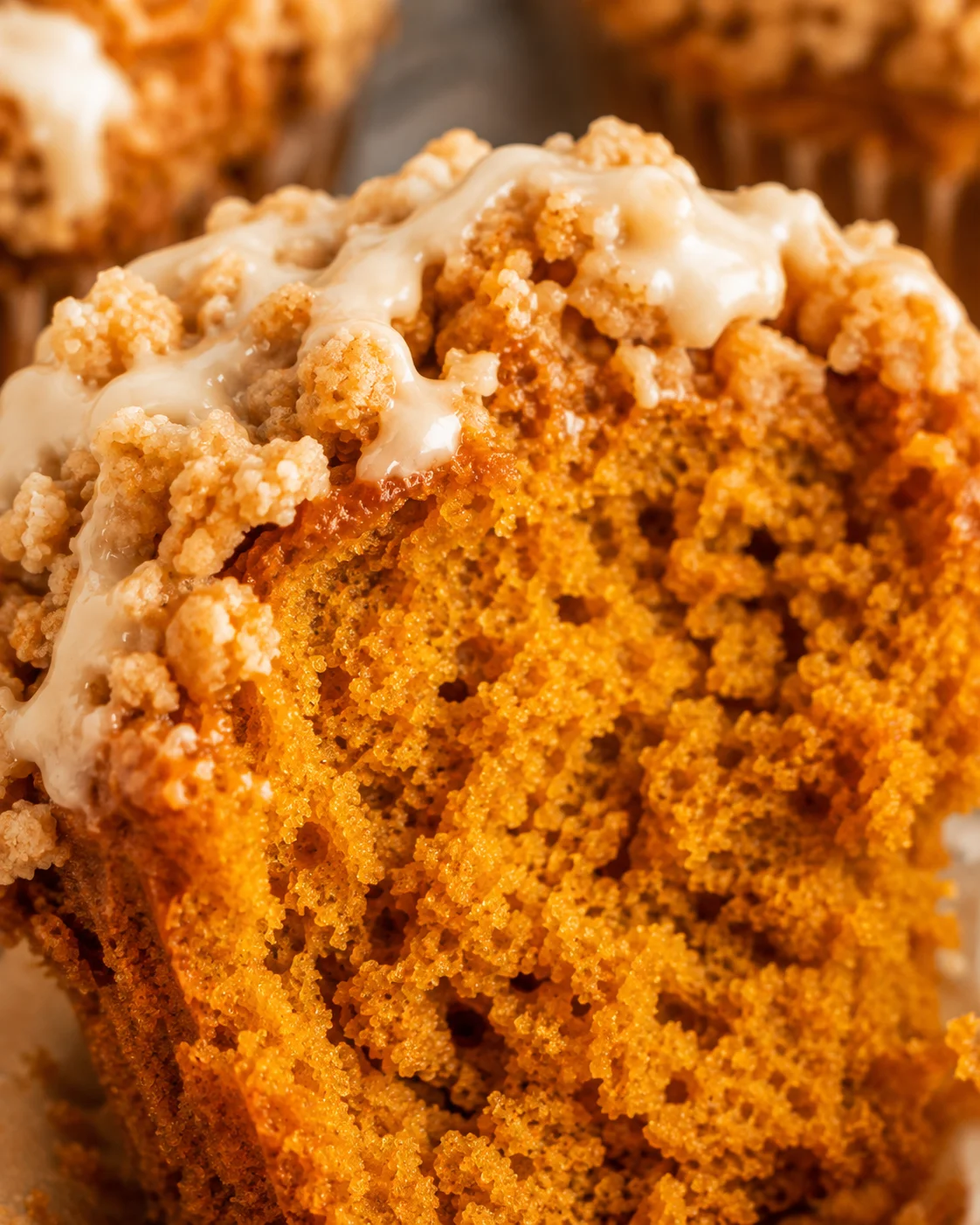 Macro view of the interior crumb and streusel of a gluten free pumpkin muffin
